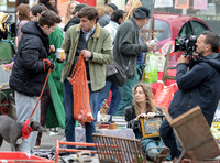 Mathew Baynton and others including film crew filming market scene from "Apocalypse Slough"