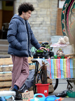 Joel Fry filming a market scene in "Apocalypse Slough"