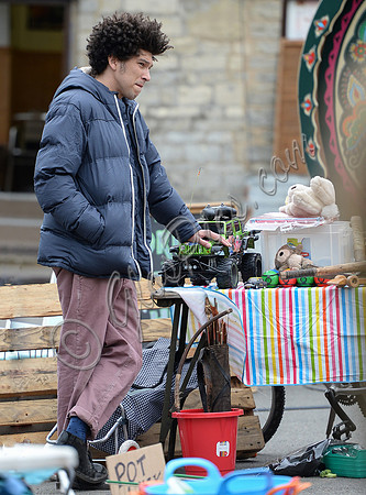 Joel Fry filming a market scene in "Apocalypse Slough"