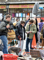 Mathew Baynton and others including film crew filming market scene from "Apocalypse Slough"
