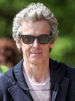 Tight head shot of Peter Capaldi wearing Ray Ban sunglasses