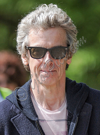 Tight head shot of Peter Capaldi wearing Ray Ban sunglasses