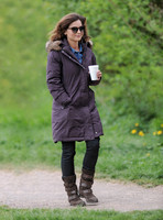 Full length shot of Jenna Coleman on 29th birthday, on set to film Doctor Who, wearing sunglasses and padded purple coat holding polystyrene cup