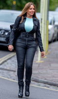 Carole Vorderman shows off her curves in leather look jumpsuit