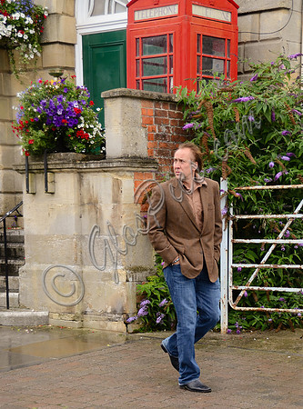 Nicolas Cagepassing Glastonbury Town Hall