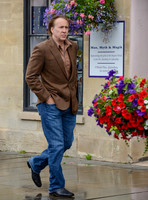 Nicolas Cage wandering past "Man, Myth and Magik" in Glastonbury