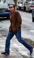 Nicolas Cage wandering around Glastonbury in the rain