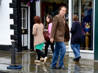 Nicolas Cage wandering around Glastonbury in the rain