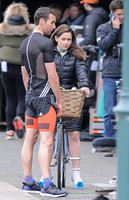 Rehearsal- head on full length shot of Emilia Clarke on bicycle arguing with Matthew Lewis.