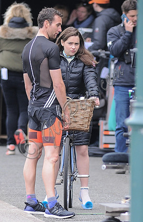 Rehearsal- head on full length shot of Emilia Clarke on bicycle arguing with Matthew Lewis.