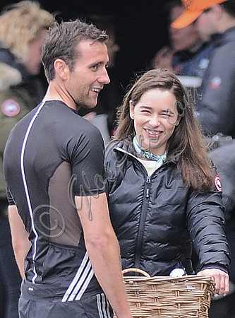 Close up of Matthew Lewis talking to Emilia Clarke on bicycle