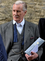 Close up of David Robb with champagne and card