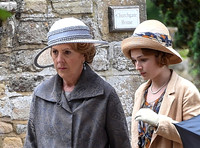 Close up of Penelope Wilton in costume with one other