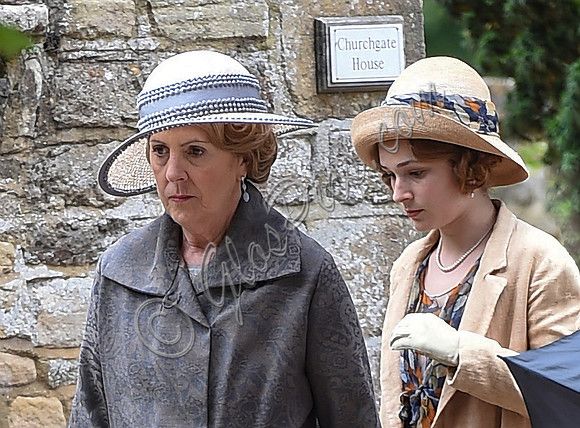 Close up of Penelope Wilton in costume with one other