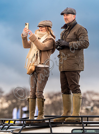 Geri Halliwell Horner and Christian Horner watch the racing from atop the Landrover