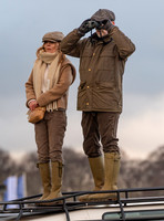 Geri Halliwell Horner and Christian Horner watch the racing from atop the Landrover