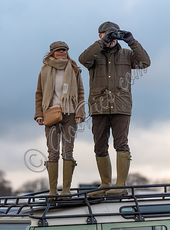 Geri Halliwell Horner and Christian Horner watch the racing from atop the Landrover