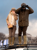 Geri Halliwell Horner and Christian Horner watch the racing from atop the Landrover