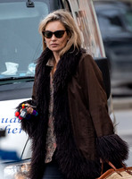 Kate Moss alone wearing sunglasses