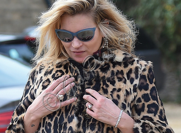 Kate Moss wearing Burberry Prorsum leopard print rabbit fur coat