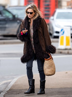 Kate Moss alone wearing sunglasses