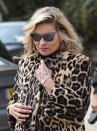 Kate Moss wearing Burberry Prorsum leopard print rabbit fur coat