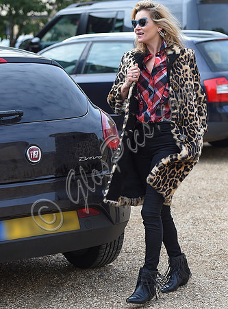 Kate Moss wearing Burberry Prorsum leopard print rabbit fur coat