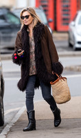 Kate Moss alone wearing sunglasses