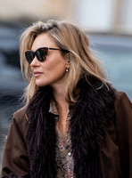 Kate Moss alone wearing sunglasses