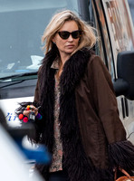 Kate Moss alone wearing sunglasses