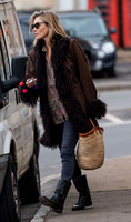 Kate Moss alone wearing sunglasses
