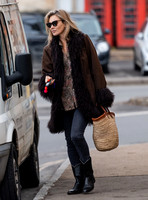 Kate Moss alone wearing sunglasses