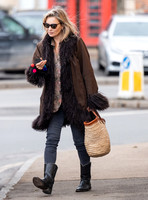 Kate Moss alone wearing sunglasses