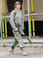Gemma Arterton in fatigues carrying rifle