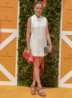 Emily Pearson wearing a natural cowl necked mini dress