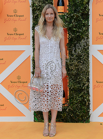 Martha Ward wearing a white lace dress.
