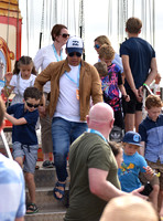 Jamie Oliver with Petal Blossom Rainbow and Buddy Bear Maurice on fairground ride at Big Feastival