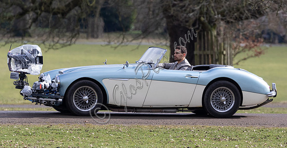 Theo James driving Austin Healey, filming scenes for "The Gentlemen"