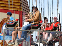Jamie Oliver and Buddy Bear Maurice on fairground ride at Big Feastival