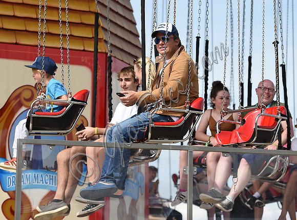 Jamie Oliver and Buddy Bear Maurice on fairground ride at Big Feastival