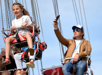 Jamie Oliver with Petal Blossom Rainbow and Buddy Bear Maurice on fairground ride at Big Feastival