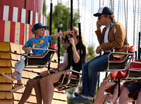 Jamie Oliver and Buddy Bear Maurice on fairground ride at Big Feastival