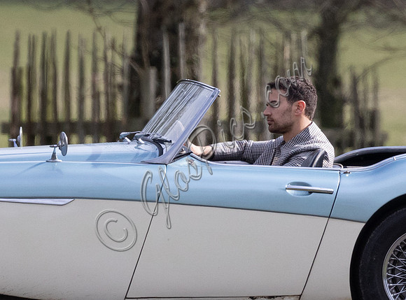 Theo James driving Austin Healey, filming scenes for "The Gentlemen"