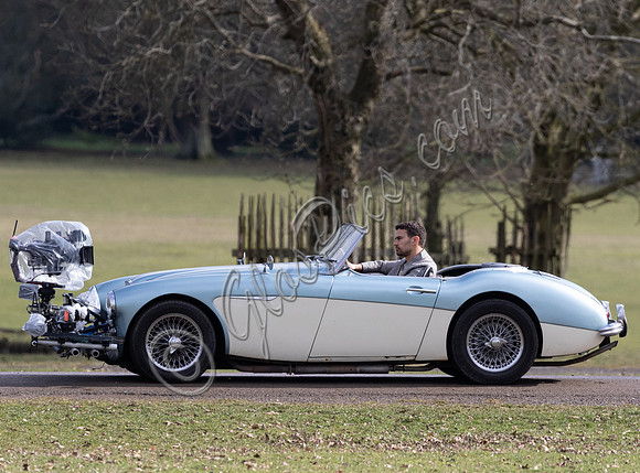 Theo James driving Austin Healey, filming scenes for "The Gentlemen"