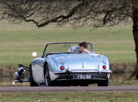 Theo James driving Austin Healey, filming scenes for "The Gentlemen"