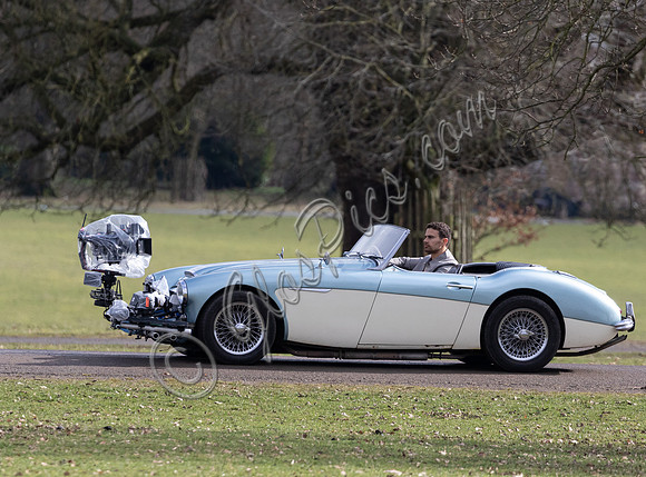 Theo James driving Austin Healey, filming scenes for "The Gentlemen"