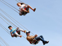 Jamie Oliver with Petal Blossom Rainbow and Buddy Bear Maurice on fairground ride at Big Feastival