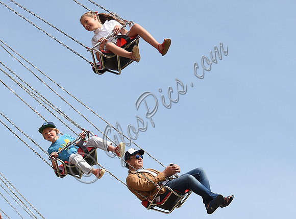 Jamie Oliver with Petal Blossom Rainbow and Buddy Bear Maurice on fairground ride at Big Feastival