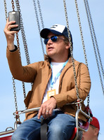 Jamie Oliver on fairground ride at Big Feastival