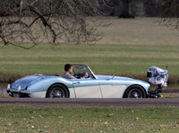 Theo James driving Austin Healey, filming scenes for "The Gentlemen"